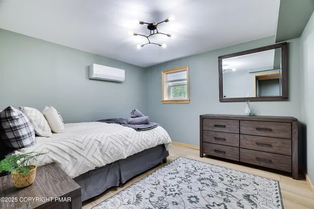 a bedroom with a bed and a dresser