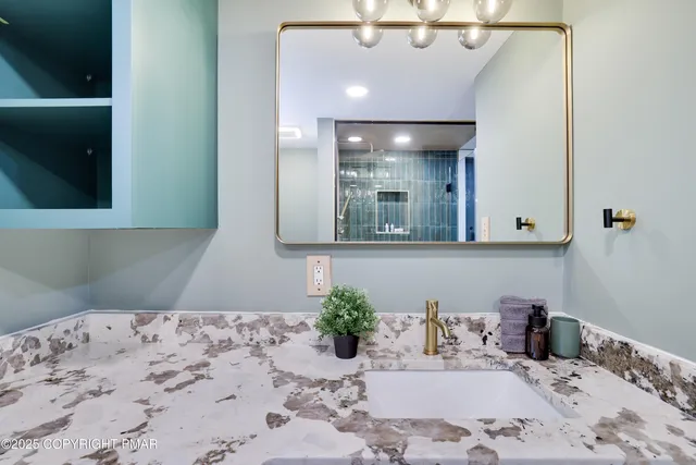 a bathroom with a sink and a mirror