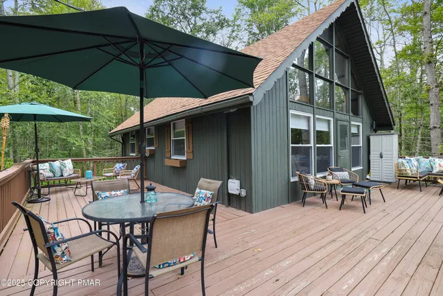 a table and chairs in patio of the house