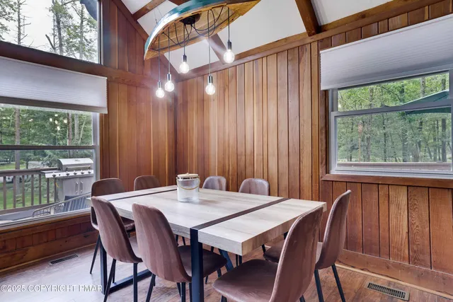 a view of a dining room with furniture window and outside view