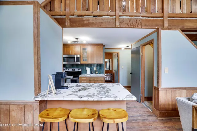 a view of kitchen with cabinets and wooden floor