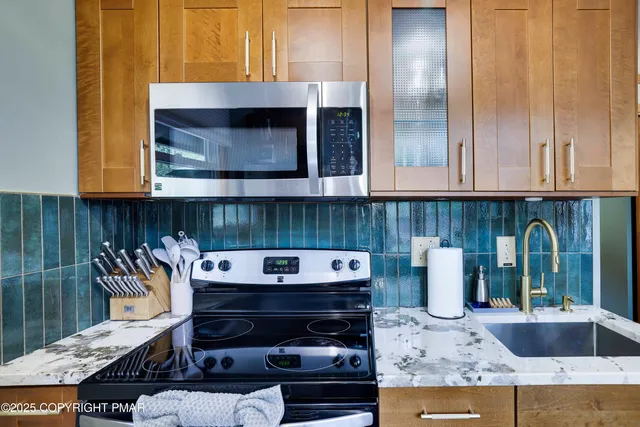a kitchen with a stove and a microwave