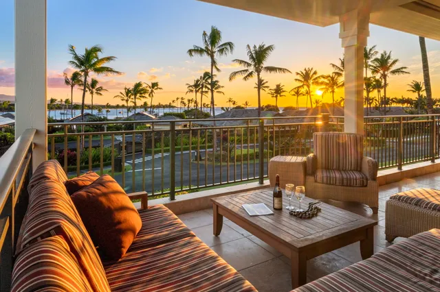 a view of a balcony with chairs