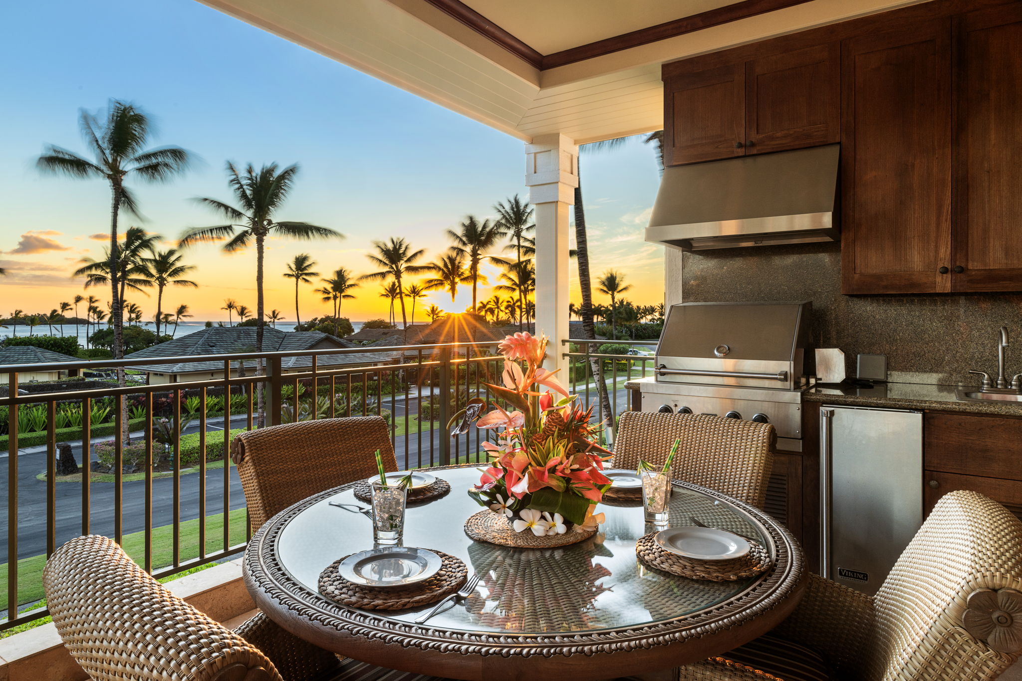 69-1000 Kolea Kai Circle, Unit 10B Waikoloa, HI 96738 - Photo 21 of 27 a view of a dining room with furniture a chandelier and wooden floor