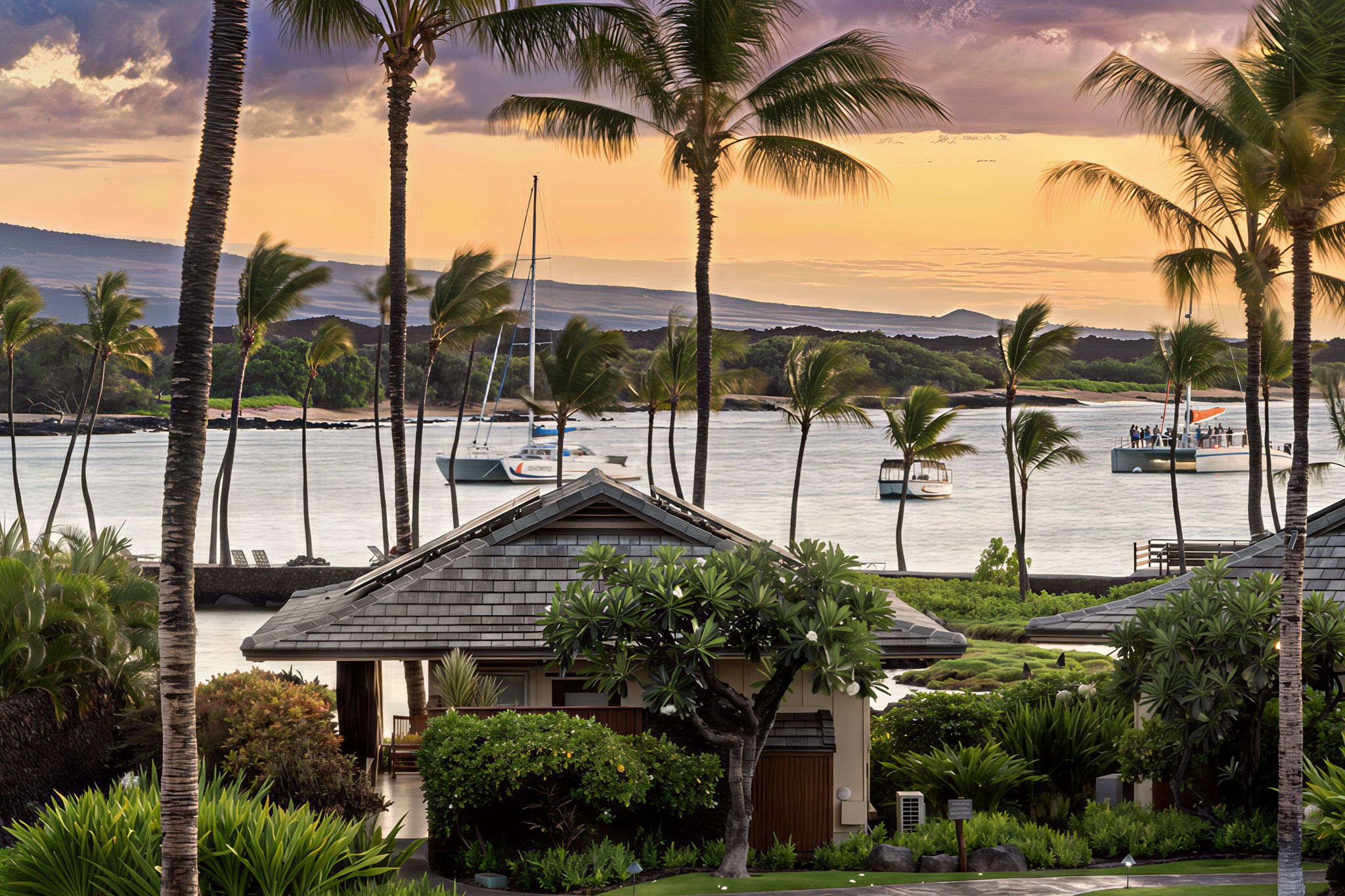 69-1000 Kolea Kai Circle, Unit 10B Waikoloa, HI 96738 - Photo 4 of 27 a view of a patio with a table and chairs under an umbrella with palm trees