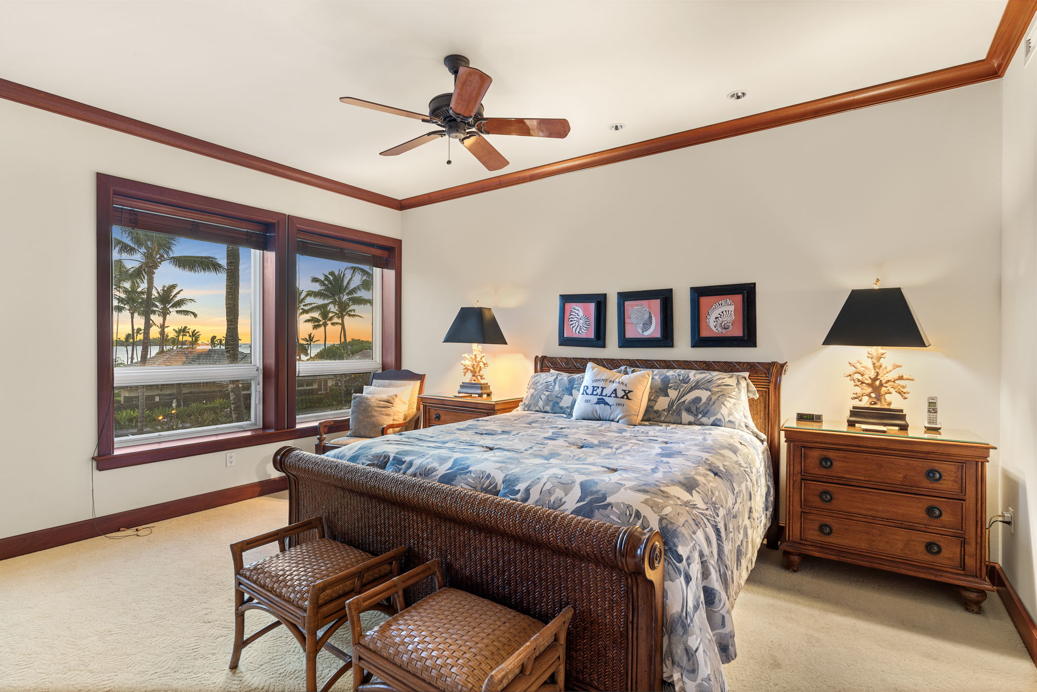 69-1000 Kolea Kai Circle, Unit 10B Waikoloa, HI 96738 - Photo 6 of 27 a bedroom with a bed and a chandelier