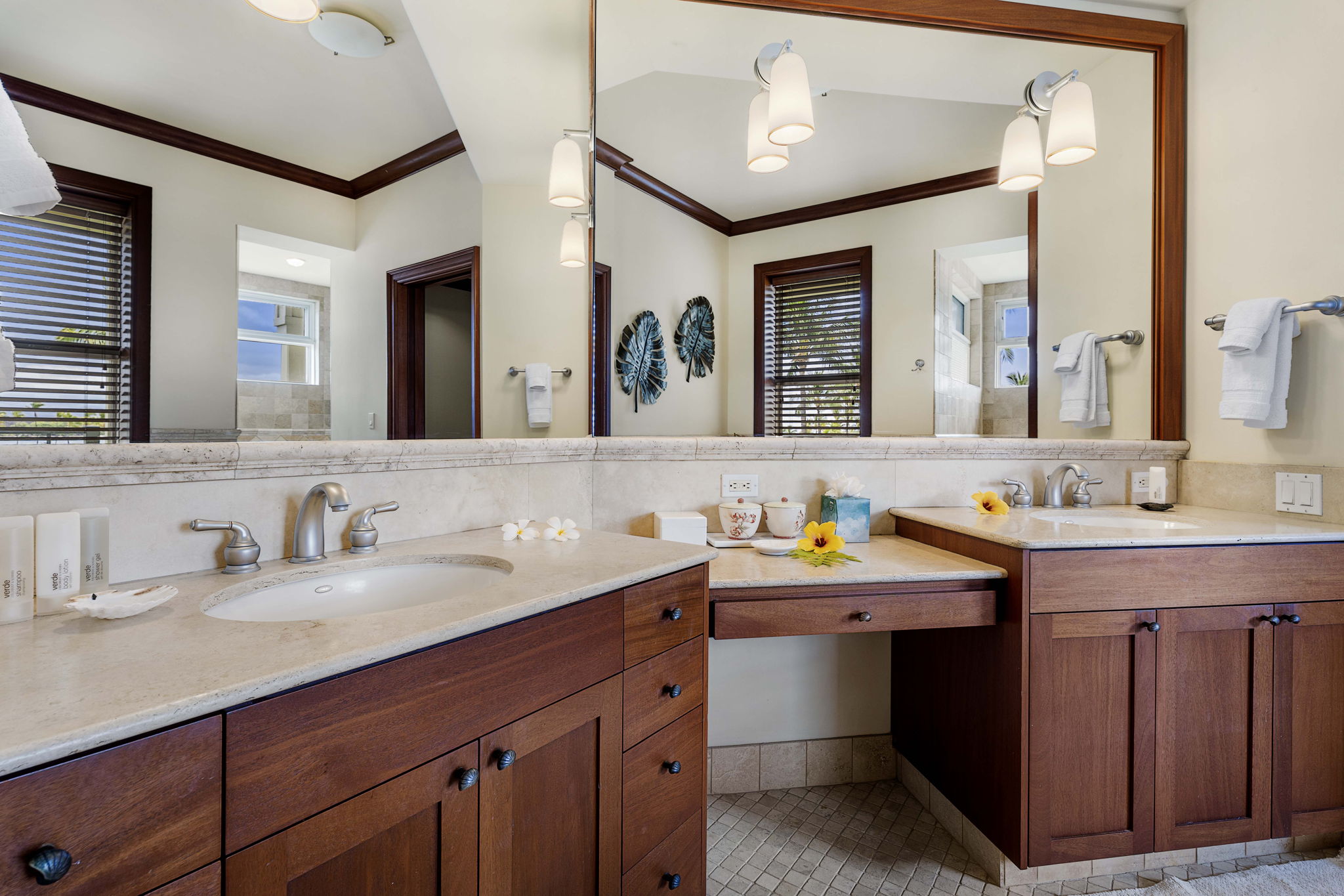 69-1000 Kolea Kai Circle, Unit 10B Waikoloa, HI 96738 - Photo 7 of 27 a bathroom with a double vanity sink and a mirror