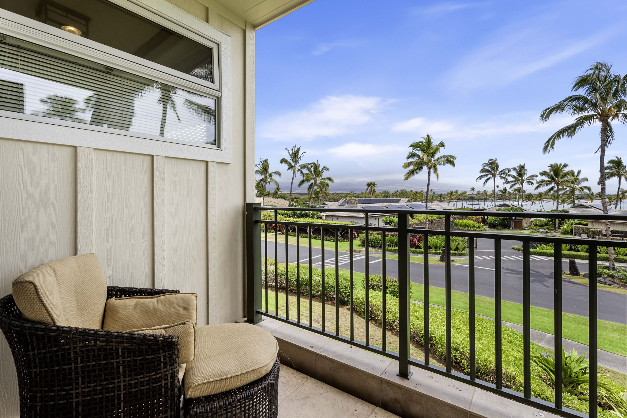 69-1000 Kolea Kai Circle, Unit 10B Waikoloa, HI 96738 - Photo 10 of 27 a balcony with table and chairs