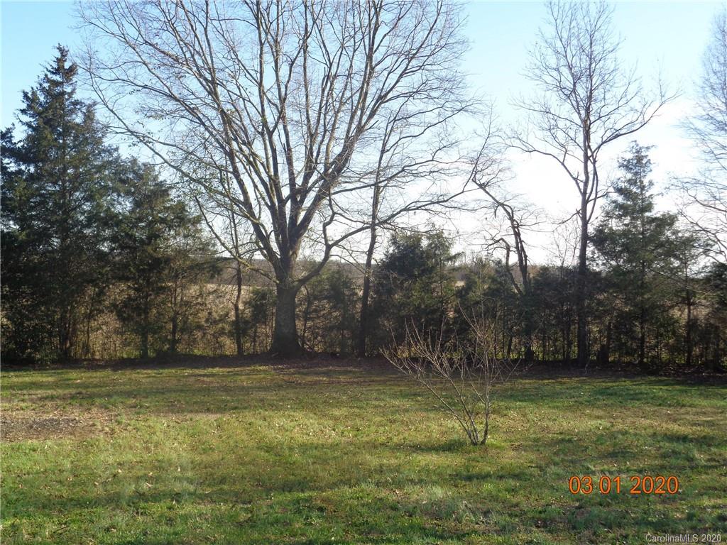 5422 Fish Road Marshville, NC 28103 - Photo 19 of 38 a view of outdoor space with deck and yard