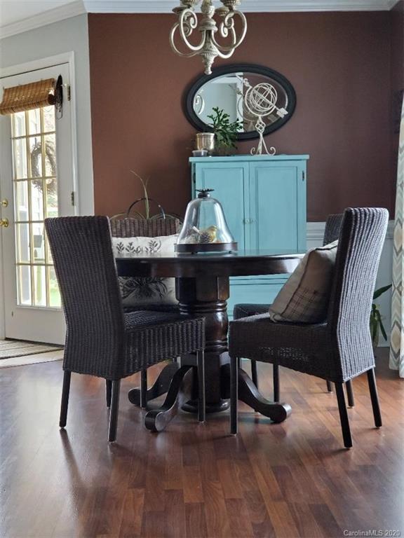 5422 Fish Road Marshville, NC 28103 - Photo 23 of 38 a view of a dining room with furniture window and wooden floor