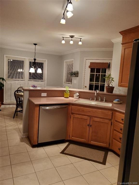 5422 Fish Road Marshville, NC 28103 - Photo 24 of 38 a kitchen with granite countertop a sink and cabinets