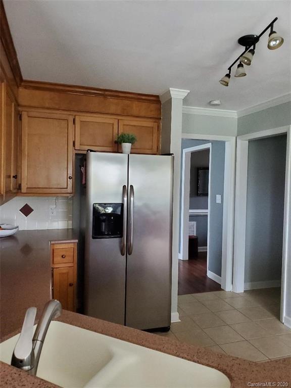 5422 Fish Road Marshville, NC 28103 - Photo 26 of 38 a metallic refrigerator freezer sitting in a kitchen