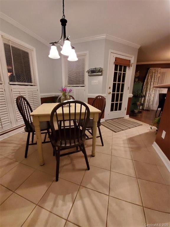 5422 Fish Road Marshville, NC 28103 - Photo 27 of 38 a view of a dining room with furniture and chandelier
