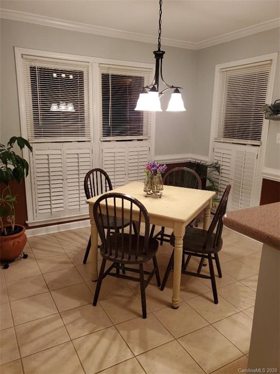 5422 Fish Road Marshville, NC 28103 - Photo 29 of 38 a view of a dining room with furniture and chandelier