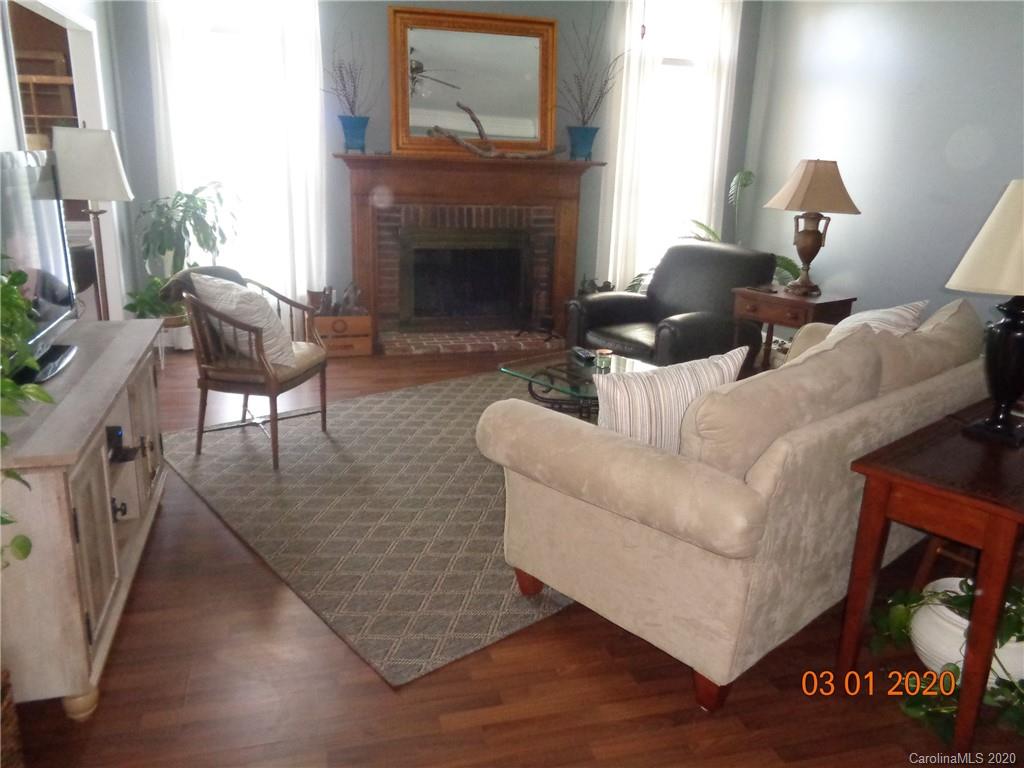 5422 Fish Road Marshville, NC 28103 - Photo 5 of 38 a living room with furniture and a fireplace