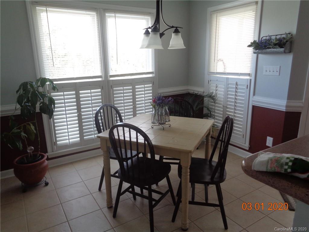 5422 Fish Road Marshville, NC 28103 - Photo 9 of 38 a view of a dining room with furniture and windows