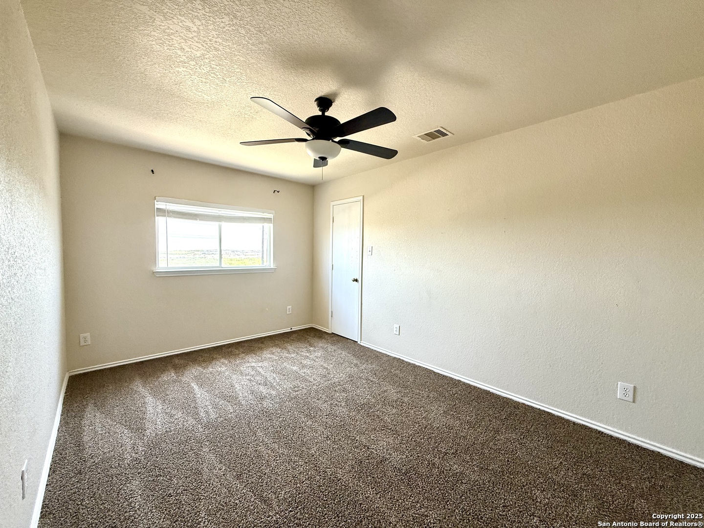 6118 Kensinger Pass Converse, TX 78109 - Photo 21 of 30 a view of an empty room with a window
