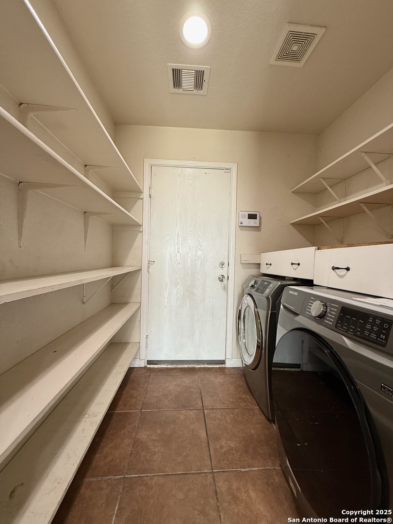 6118 Kensinger Pass Converse, TX 78109 - Photo 22 of 30 a utility room with dryer and washer