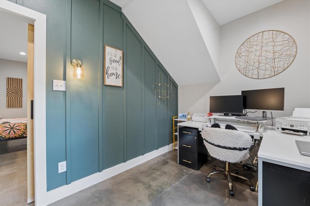 286 Benevolence Way China Spring, TX 76633 - Photo 15 of 37 Dedicated workspace featuring a board and batten accent wall in a deep teal hue