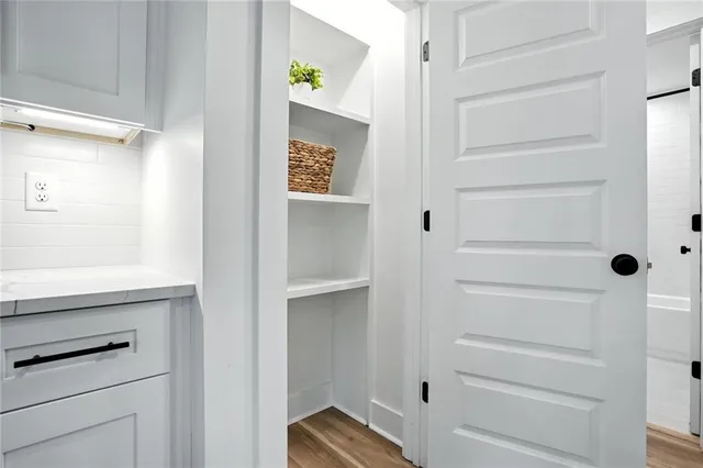 a bedroom with a large bed and a flat screen tv