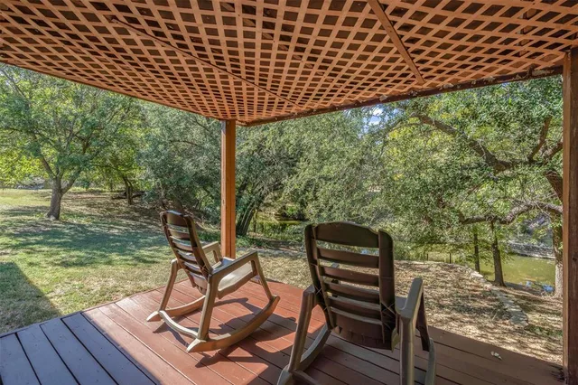 a view of a chairs and table on the wooden floor