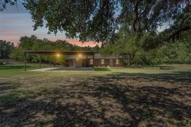 a backyard of a house with lots of green space