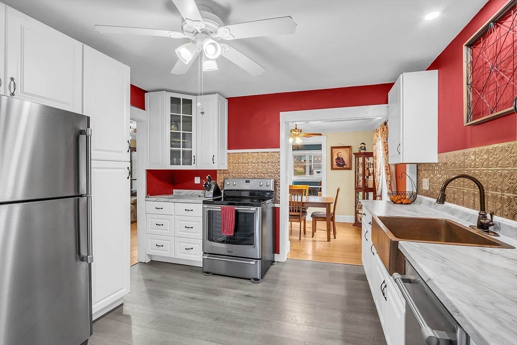 36 Mayfield Road Gardner, MA 01440 - Photo 11 of 35 a kitchen with refrigerator a stove and a sink
