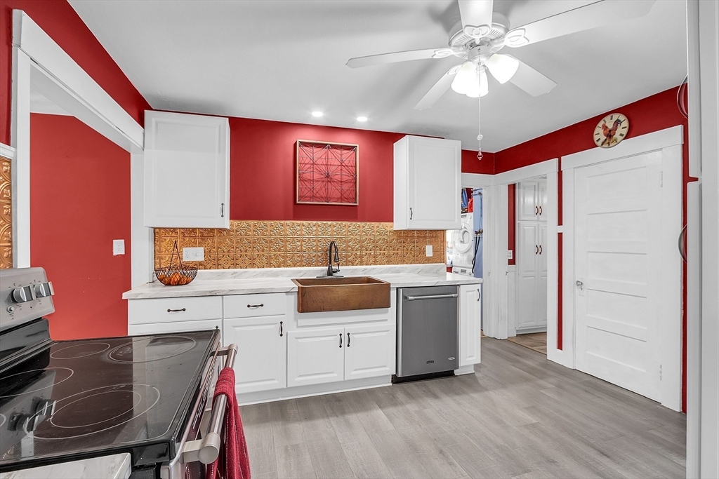 36 Mayfield Road Gardner, MA 01440 - Photo 12 of 35 a kitchen with a stove a sink and a refrigerator