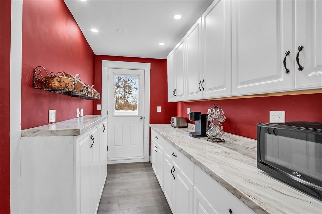 36 Mayfield Road Gardner, MA 01440 - Photo 14 of 35 a kitchen with stainless steel appliances granite countertop a stove and a refrigerator