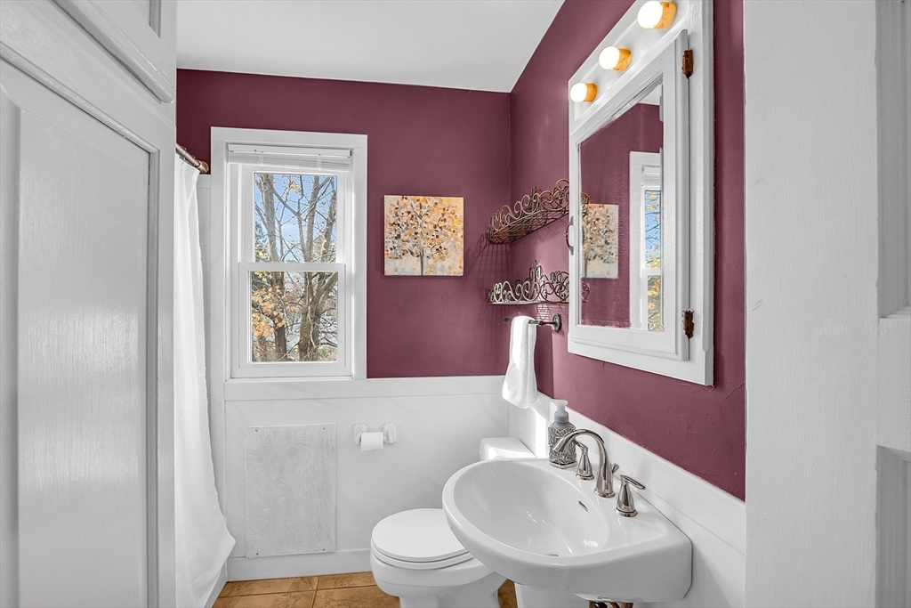36 Mayfield Road Gardner, MA 01440 - Photo 16 of 35 a bathroom with a sink mirror and a toilet