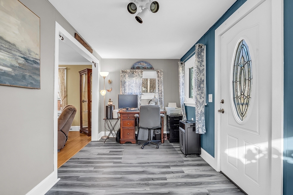 36 Mayfield Road Gardner, MA 01440 - Photo 19 of 35 a view of a hallway with wooden floor and furniture