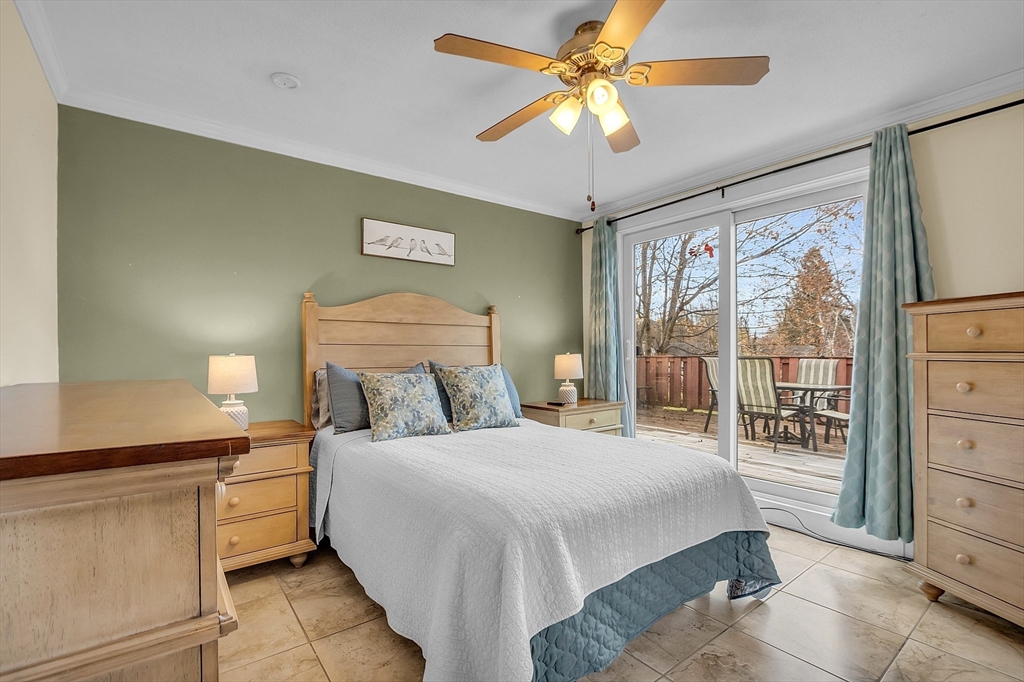 36 Mayfield Road Gardner, MA 01440 - Photo 20 of 35 a bedroom with a large bed and a chandelier