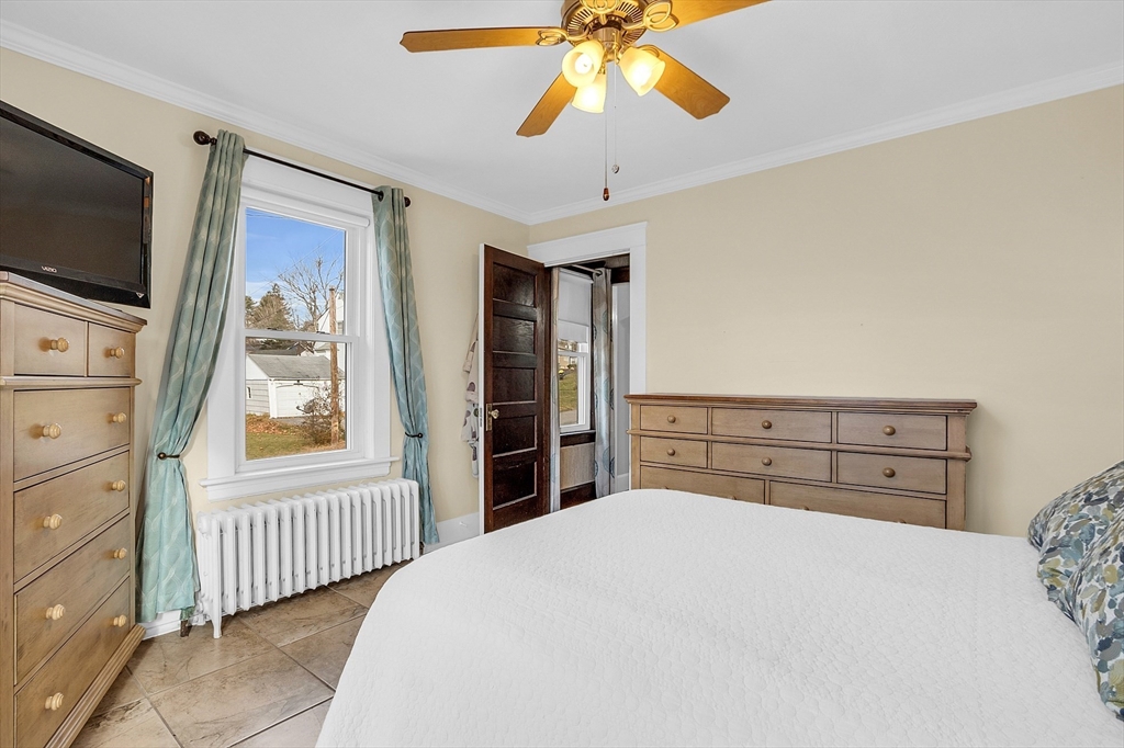 36 Mayfield Road Gardner, MA 01440 - Photo 21 of 35 a bedroom with a bed and a flat tv screen on dresser