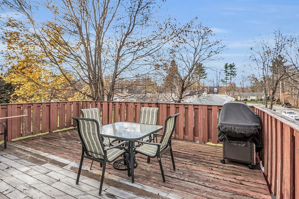 36 Mayfield Road Gardner, MA 01440 - Photo 30 of 35 a view of a wooden chairs and table on the deck
