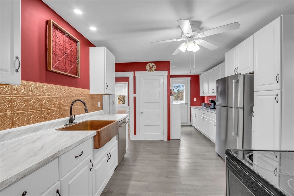36 Mayfield Road Gardner, MA 01440 - Photo 9 of 35 a kitchen with stainless steel appliances granite countertop a refrigerator a sink and dishwasher