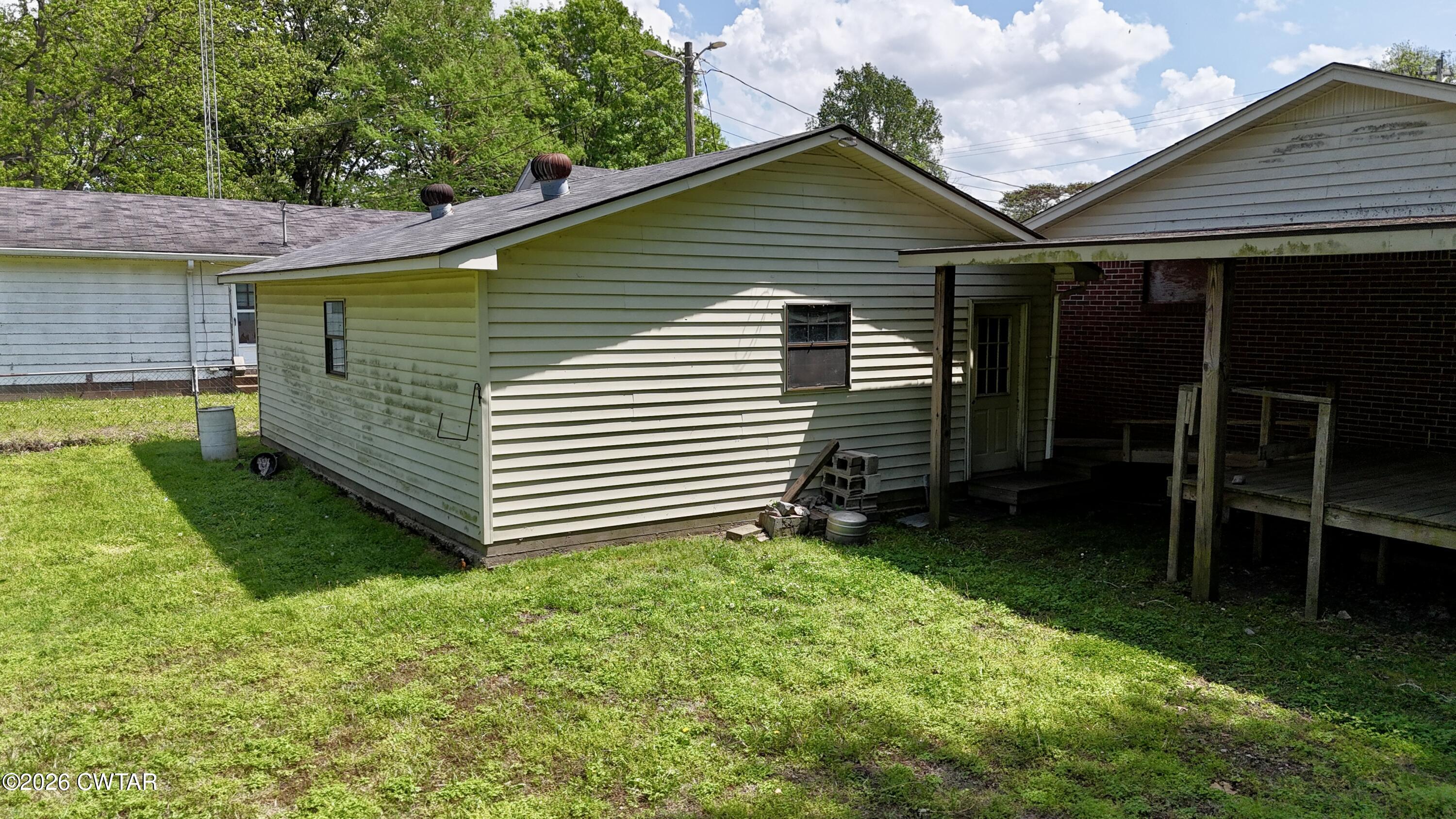 228 Lake Street Ridgely, TN 38080 - Photo 13 of 18 a view of a back yard of the house