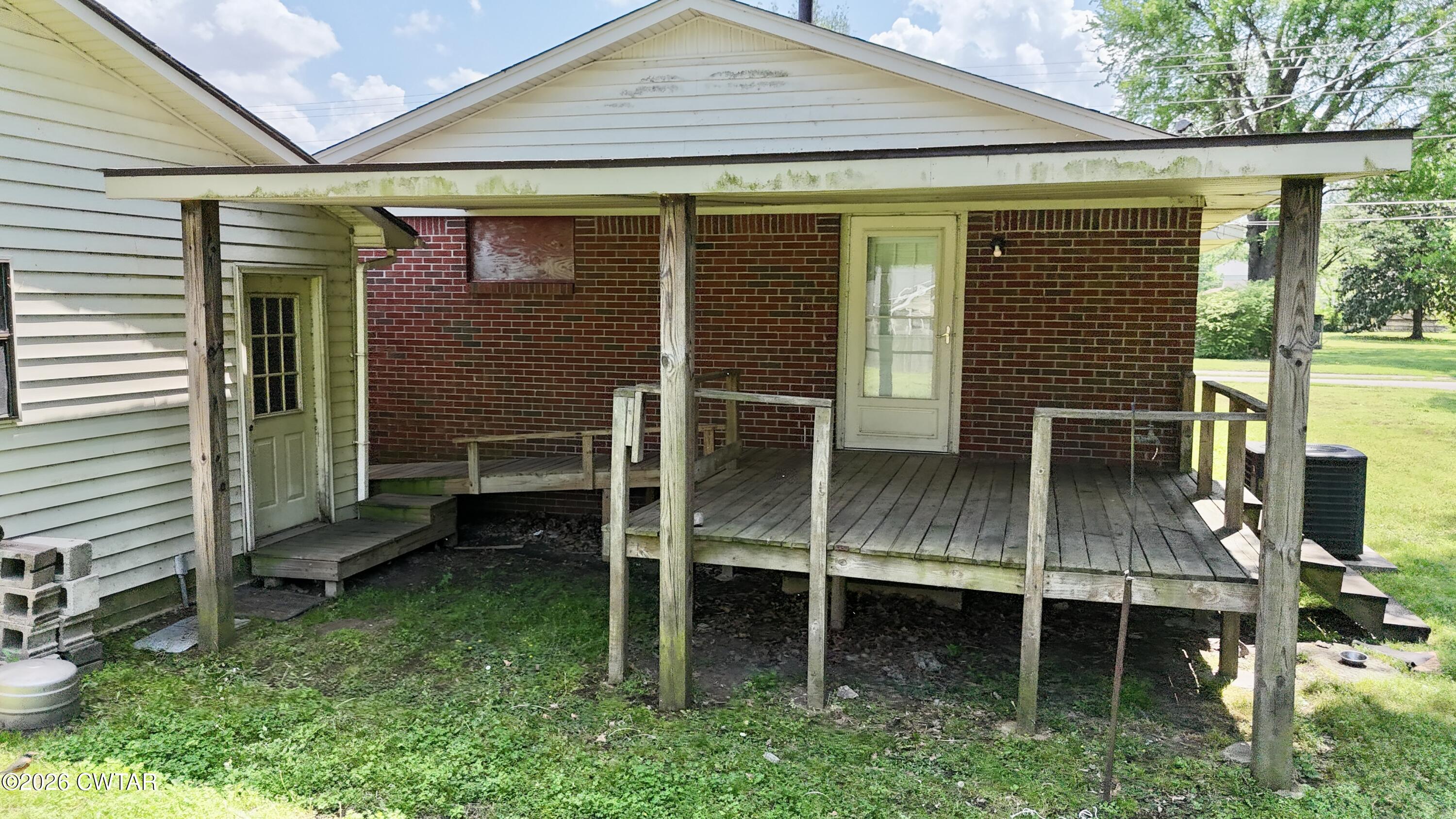 228 Lake Street Ridgely, TN 38080 - Photo 14 of 18 a view of a house with backyard and porch
