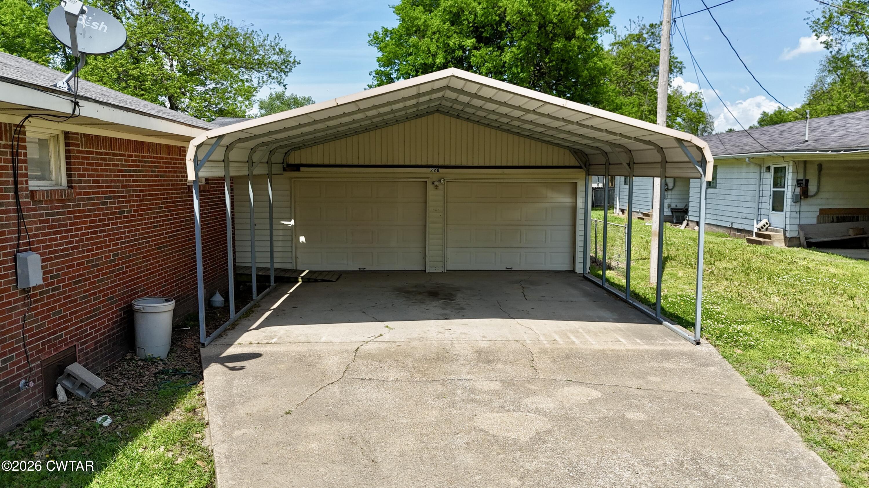 228 Lake Street Ridgely, TN 38080 - Photo 15 of 18 a view of a small house with a yard