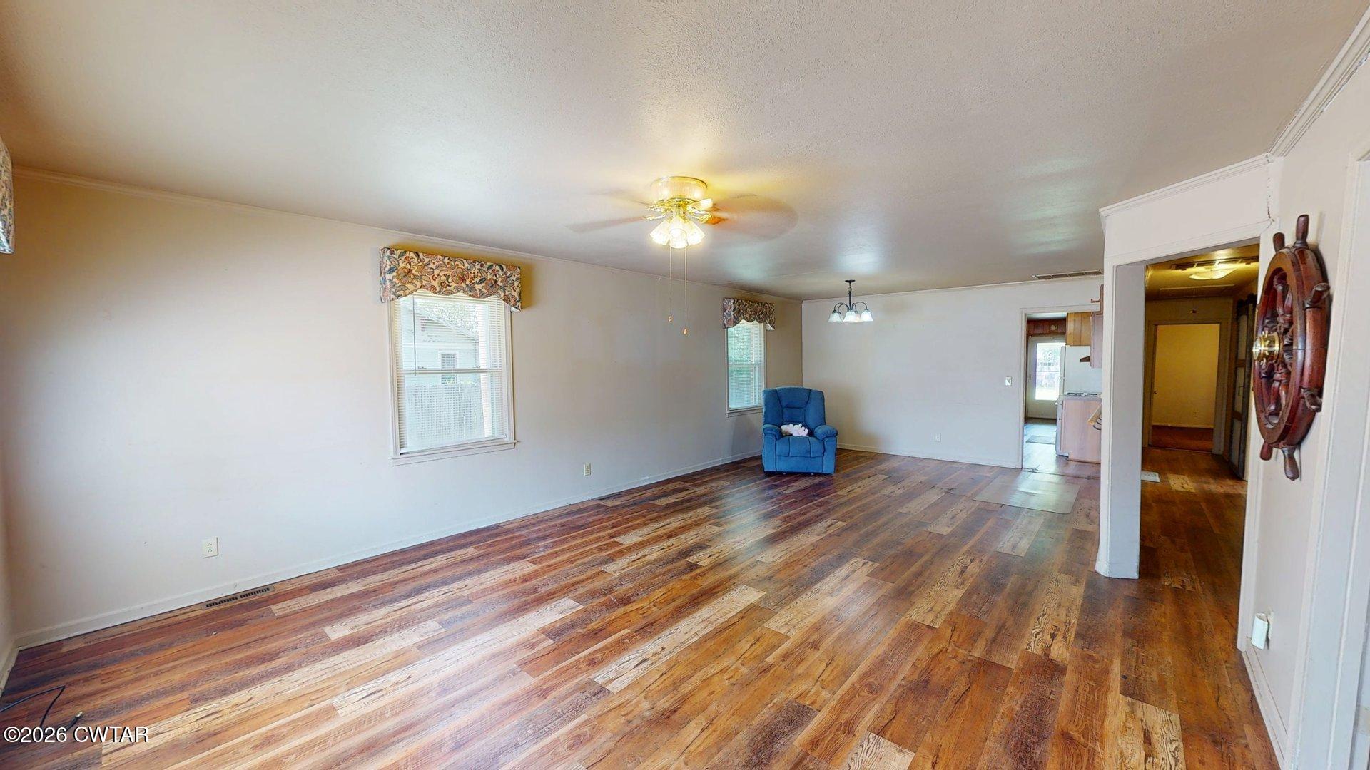 228 Lake Street Ridgely, TN 38080 - Photo 3 of 18 a view of empty room with wooden floor