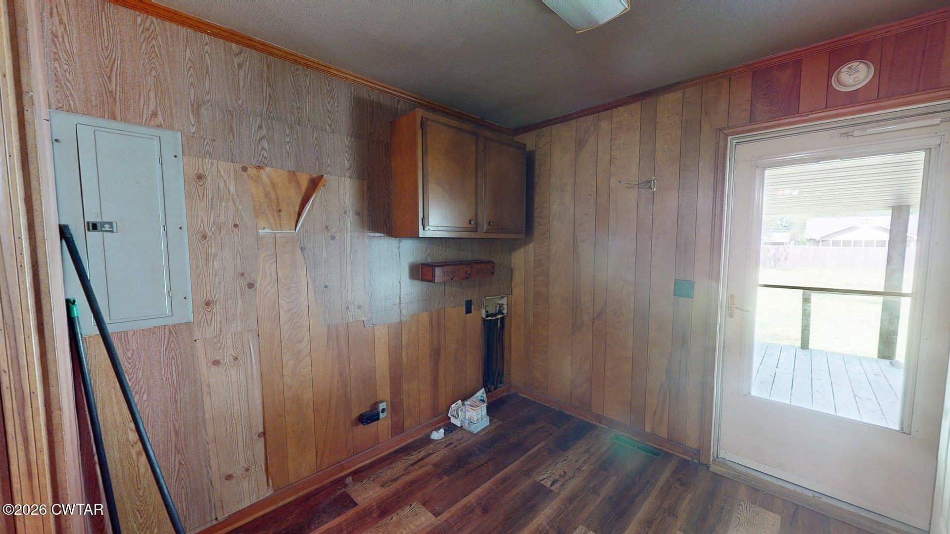 228 Lake Street Ridgely, TN 38080 - Photo 10 of 18 a view of an empty room with wooden floor and a window