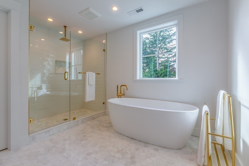 82 Border Road Needham, MA 02492 - Photo 8 of 8 a white bath tub sitting next to a shower