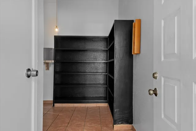 a bathroom with a walk in closet