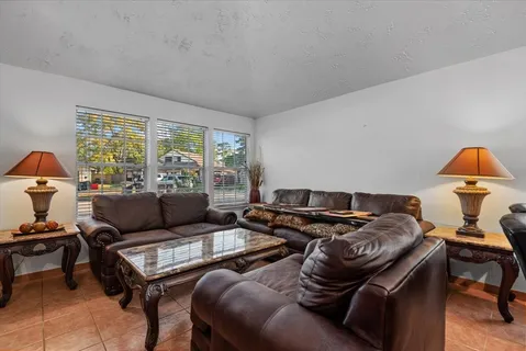 a living room with furniture and a window