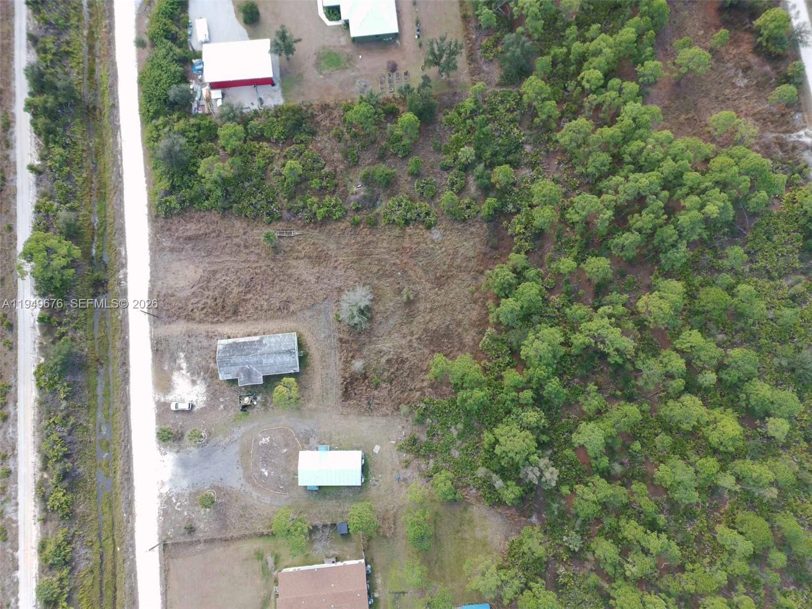 8357 Strasse Boulevard Punta Gorda, FL 33982 - Photo 13 of 37 an aerial view of residential house with outdoor space and trees all around