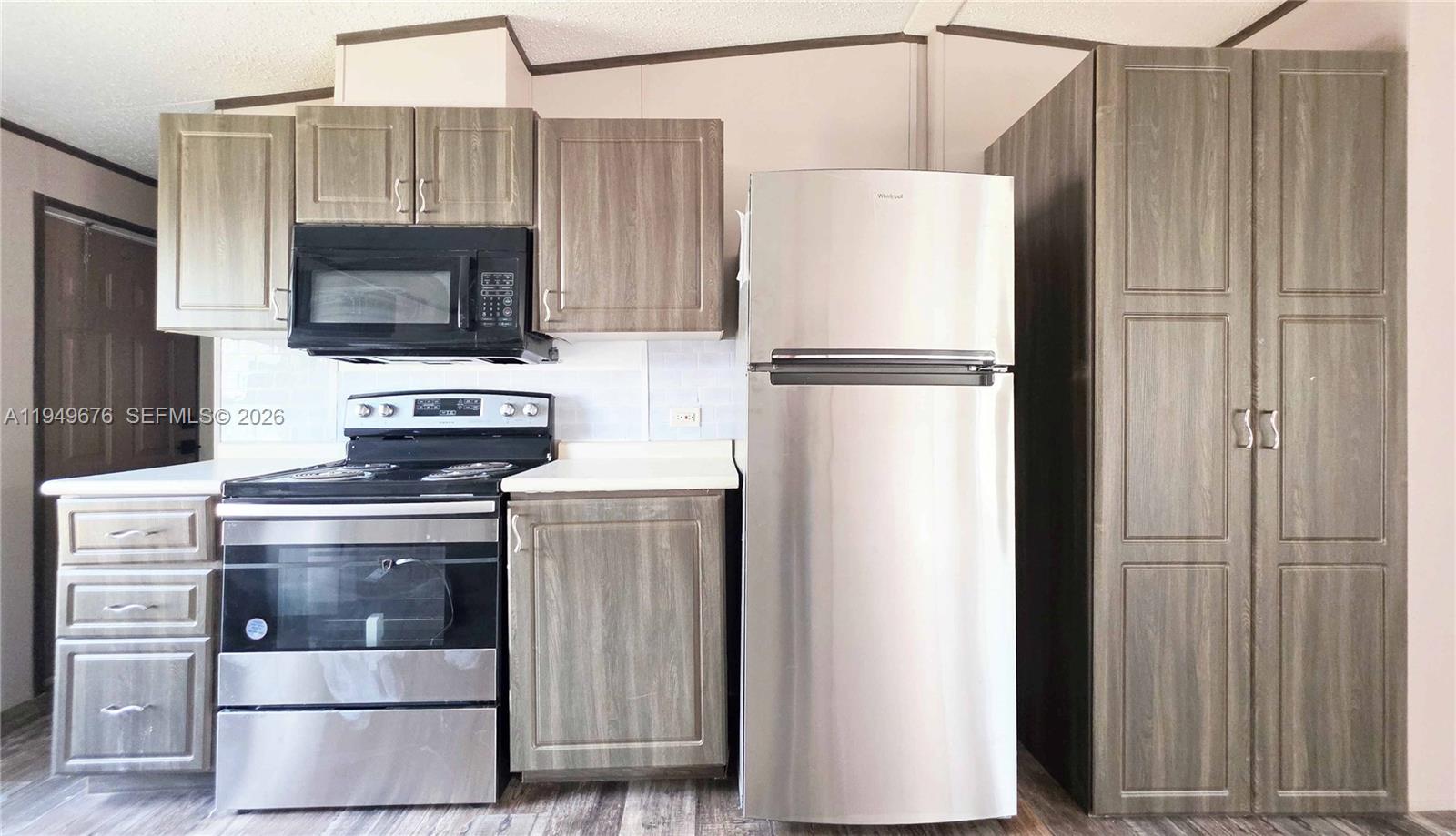 8357 Strasse Boulevard Punta Gorda, FL 33982 - Photo 23 of 37 a white refrigerator freezer and a stove sitting inside of a kitchen
