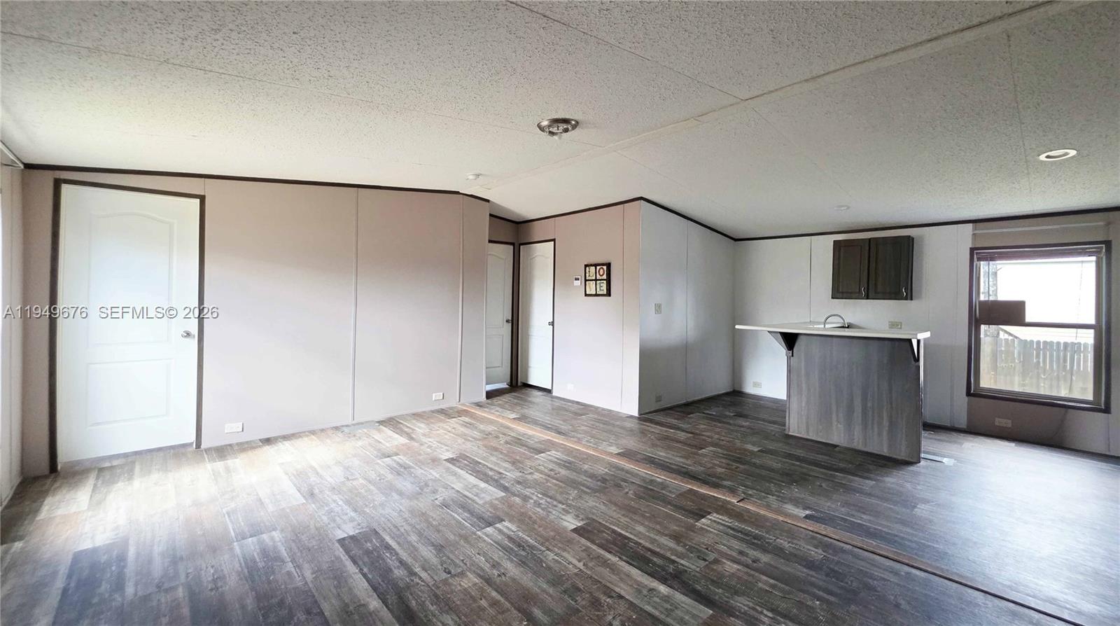 8357 Strasse Boulevard Punta Gorda, FL 33982 - Photo 26 of 37 an empty room with wooden floor and windows