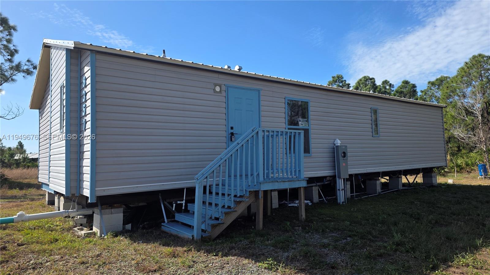 8357 Strasse Boulevard Punta Gorda, FL 33982 - Photo 8 of 37 a view of a small house and a yard