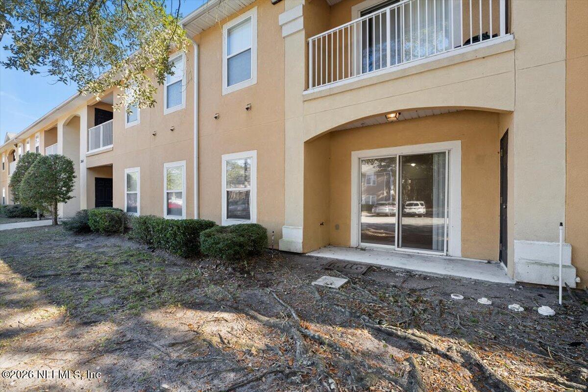 3641 Kirkpatrick Circle, Unit 141 Jacksonville, FL 32210 - Photo 2 of 25 a view of a front of house with a yard