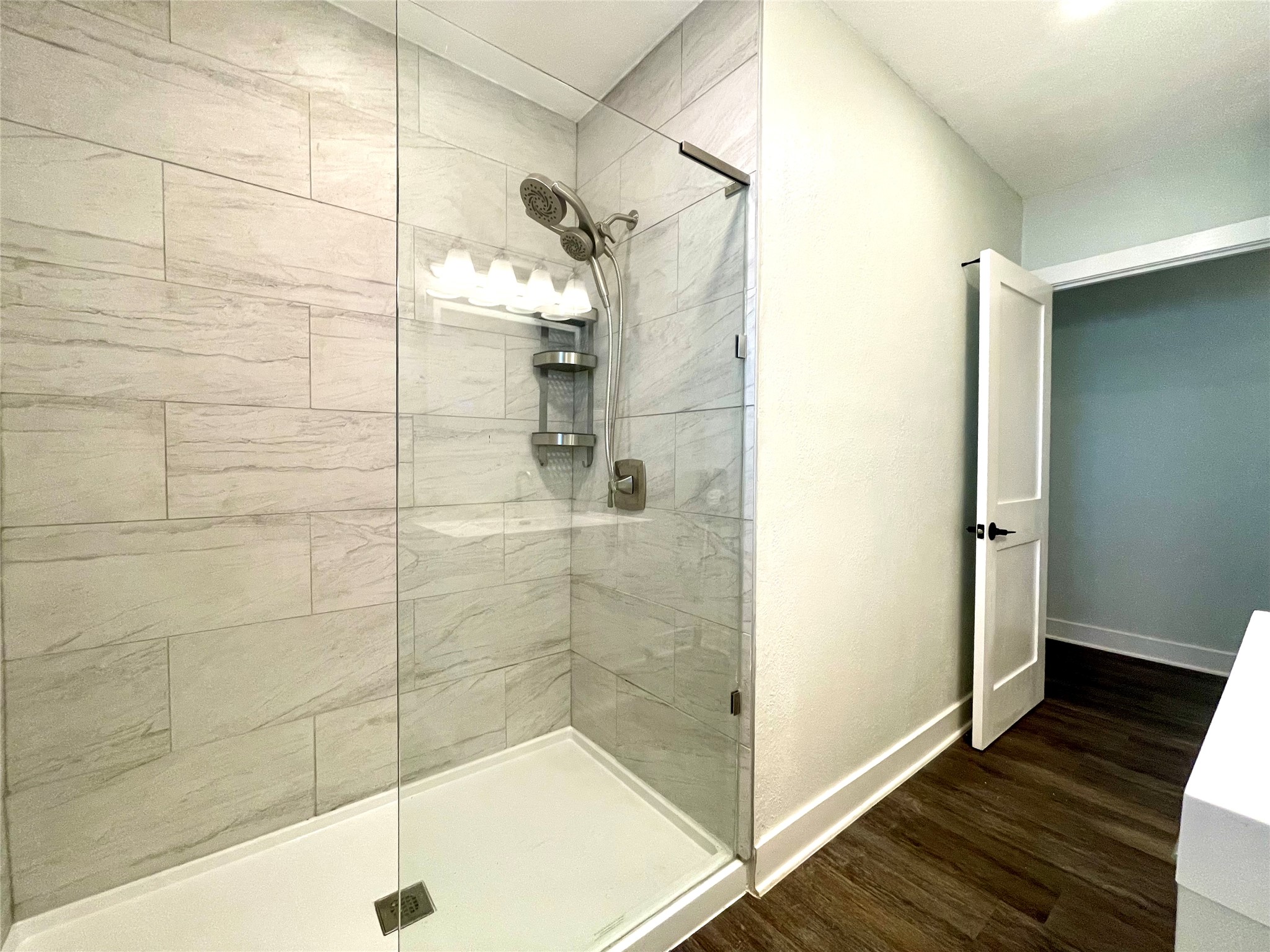 807 East Riverside Drive, Unit B Austin, TX 78704 - Photo 16 of 28 A well-appointed shower stall features sleek tilework and a convenient glass enclosure.