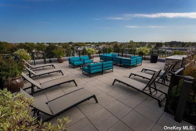an outdoor sitting area with furniture
